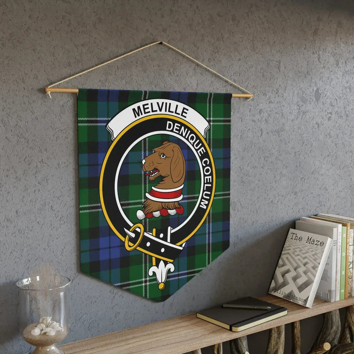 Melville Denique Coelum crest pennant on wall — laser-cut edges, bold tartan colours