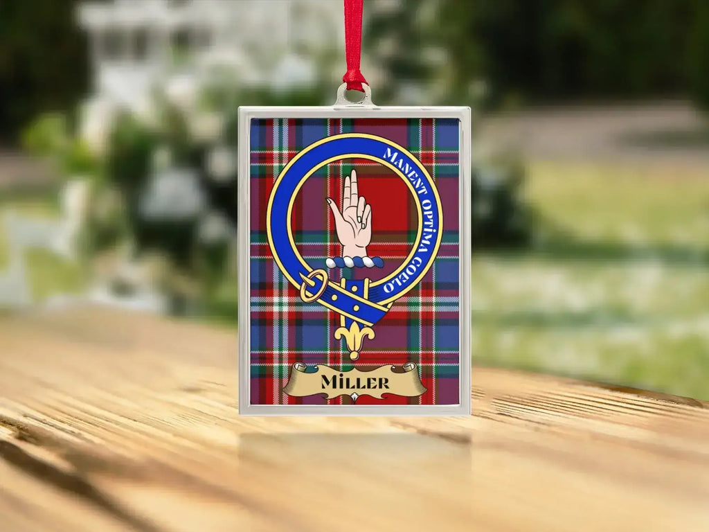 Close-up of the Miller family crest on a polished silver-frame metal ornament