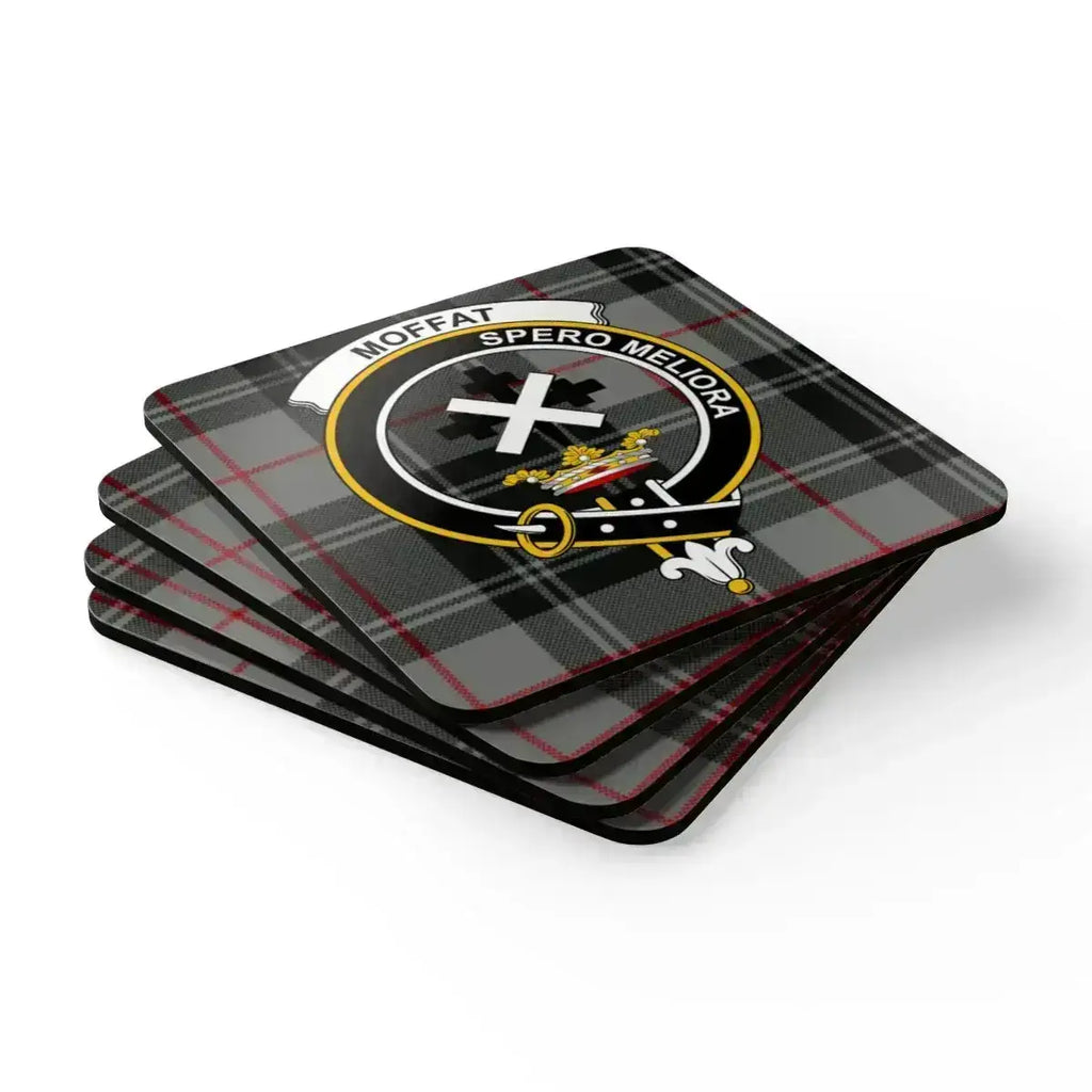 Moffat clan crest coasters on table — Scottish Spero Meliora tartan pattern, set of four