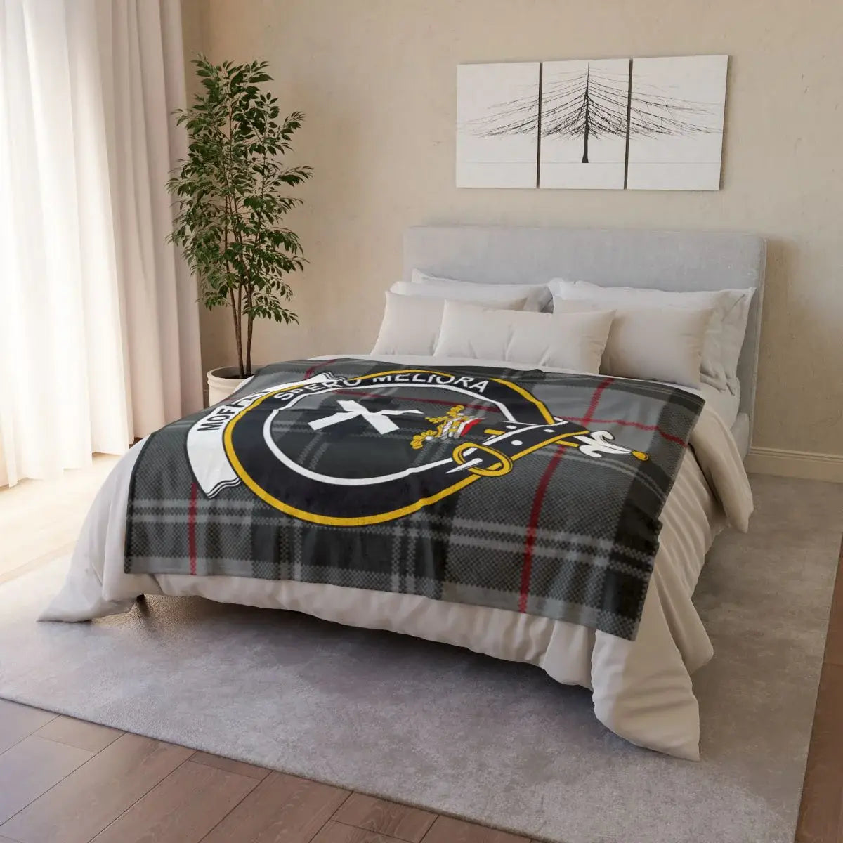 Moffat clan crest throw on sofa — printed tartan design with white reverse, hemmed edges