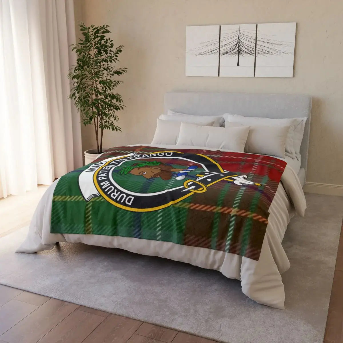 Muir clan crest tartan throw blanket on bed — printed polyester with white reverse and hemmed edges
