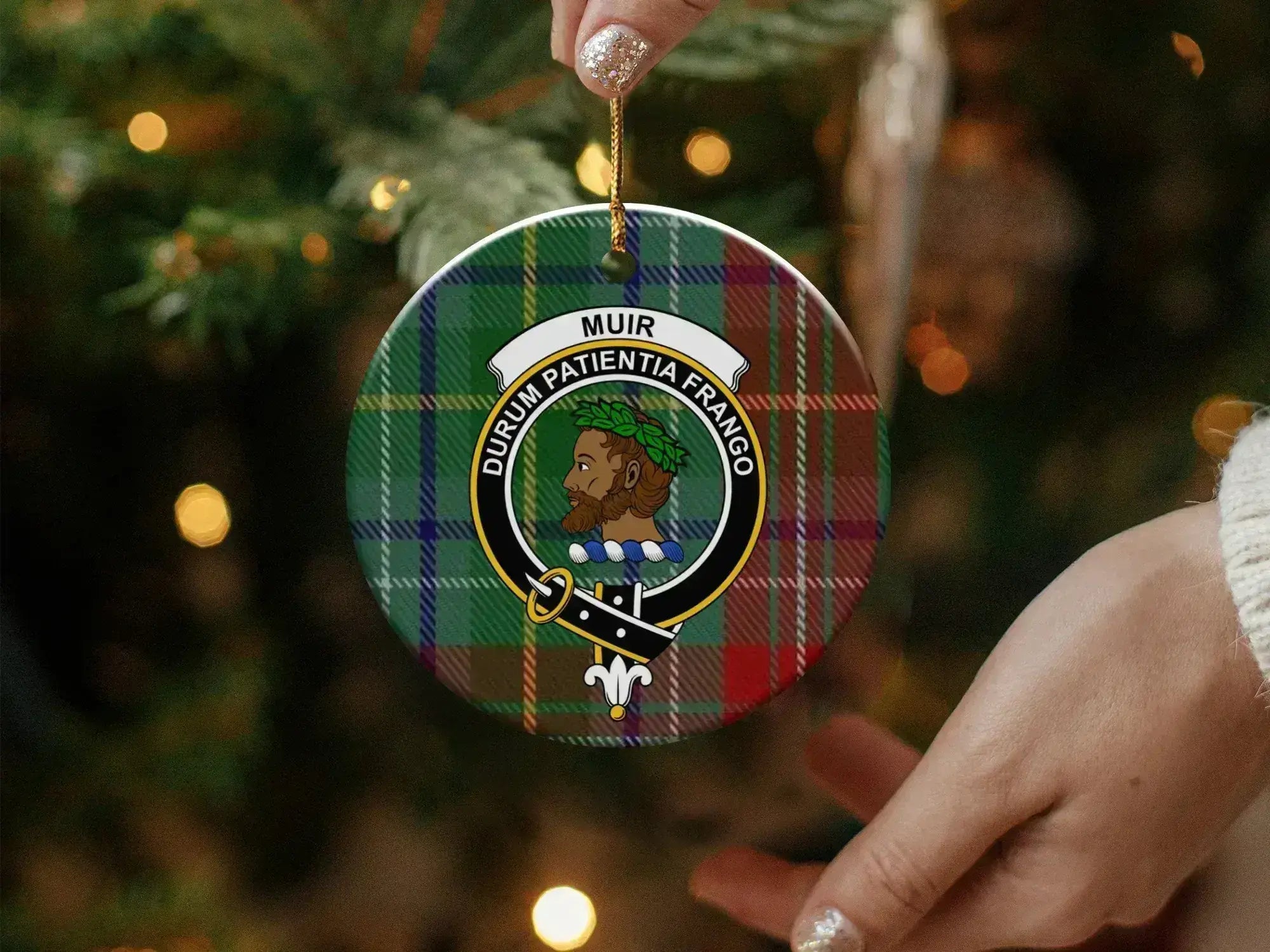 Muir family crest tartan Christmas ornament on Christmas tree — 3-inch round ceramic