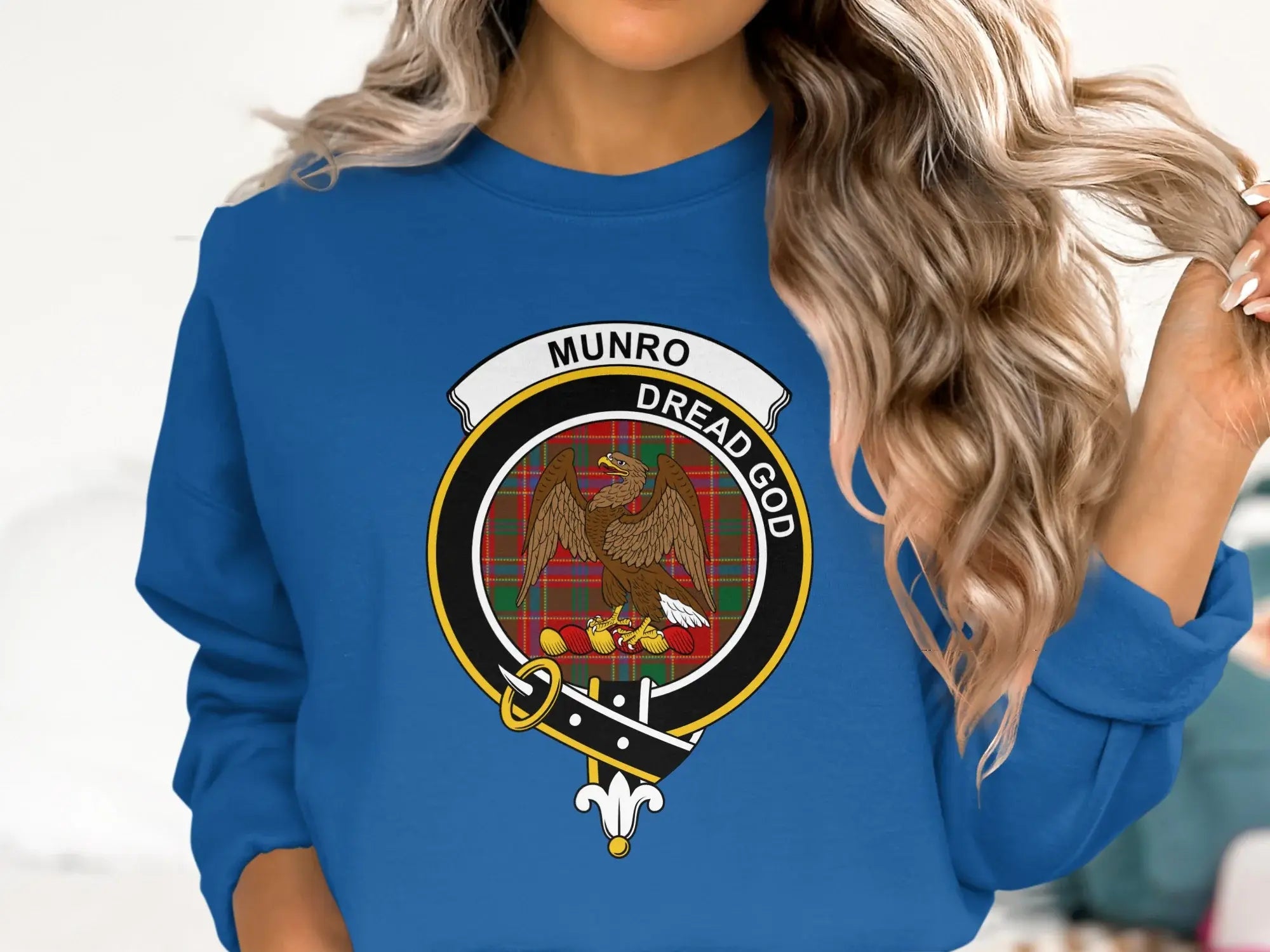 Munro Dread God crest badge emblem sweatshirt in royal blue — clan tartan on fleece pullover