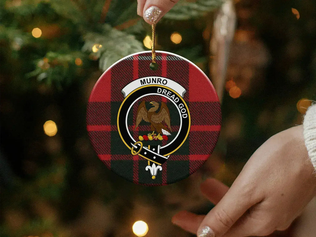 Munro clan crest tartan ornament showing pre-drilled hang hole and gold cord — 3-inch round ceramic
