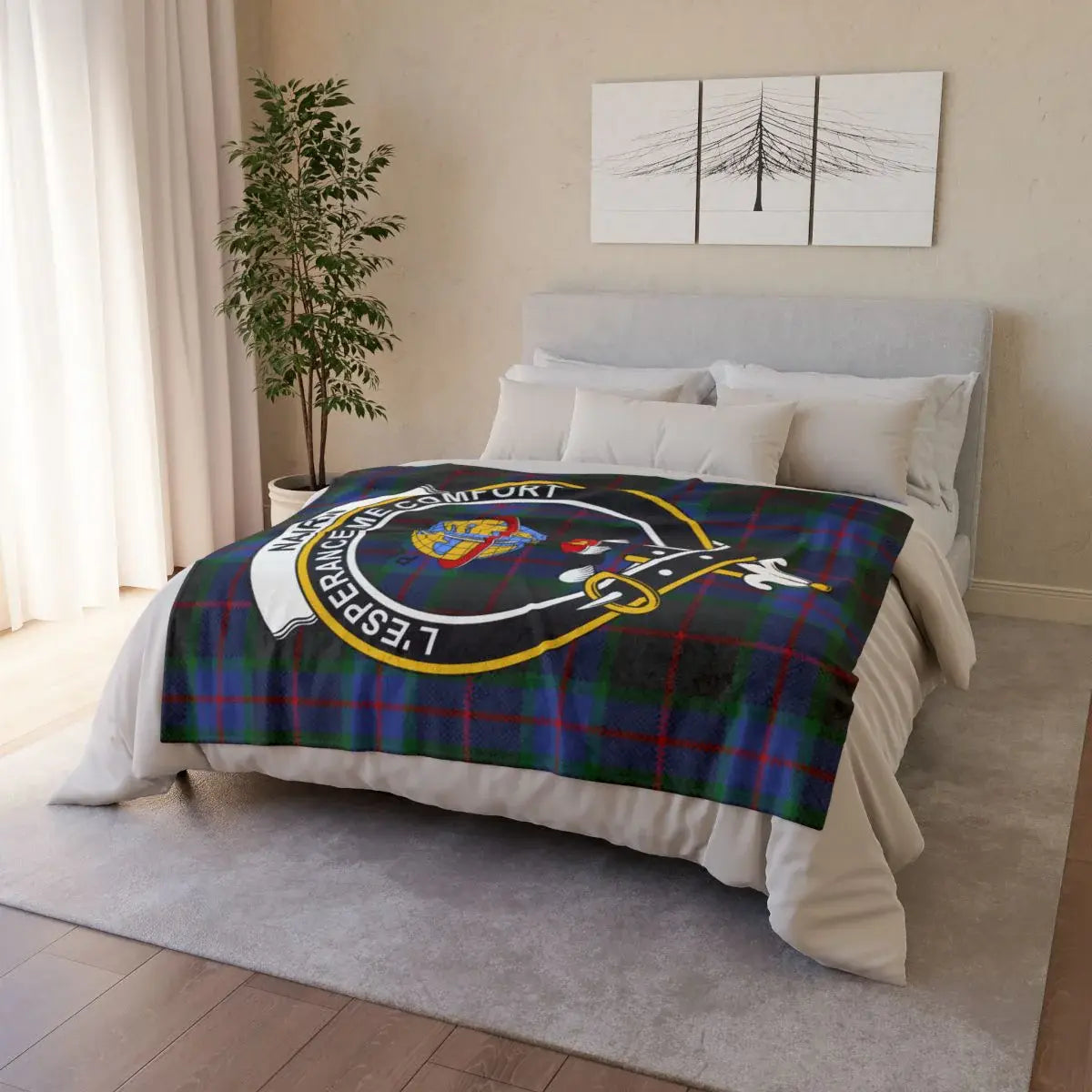 Nairn clan crest throw on sofa — printed tartan design with white reverse, hemmed edges