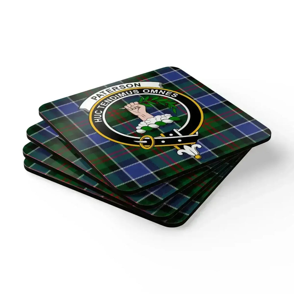 Paterson clan crest coasters on table — Scottish tartan set of four, cork backed