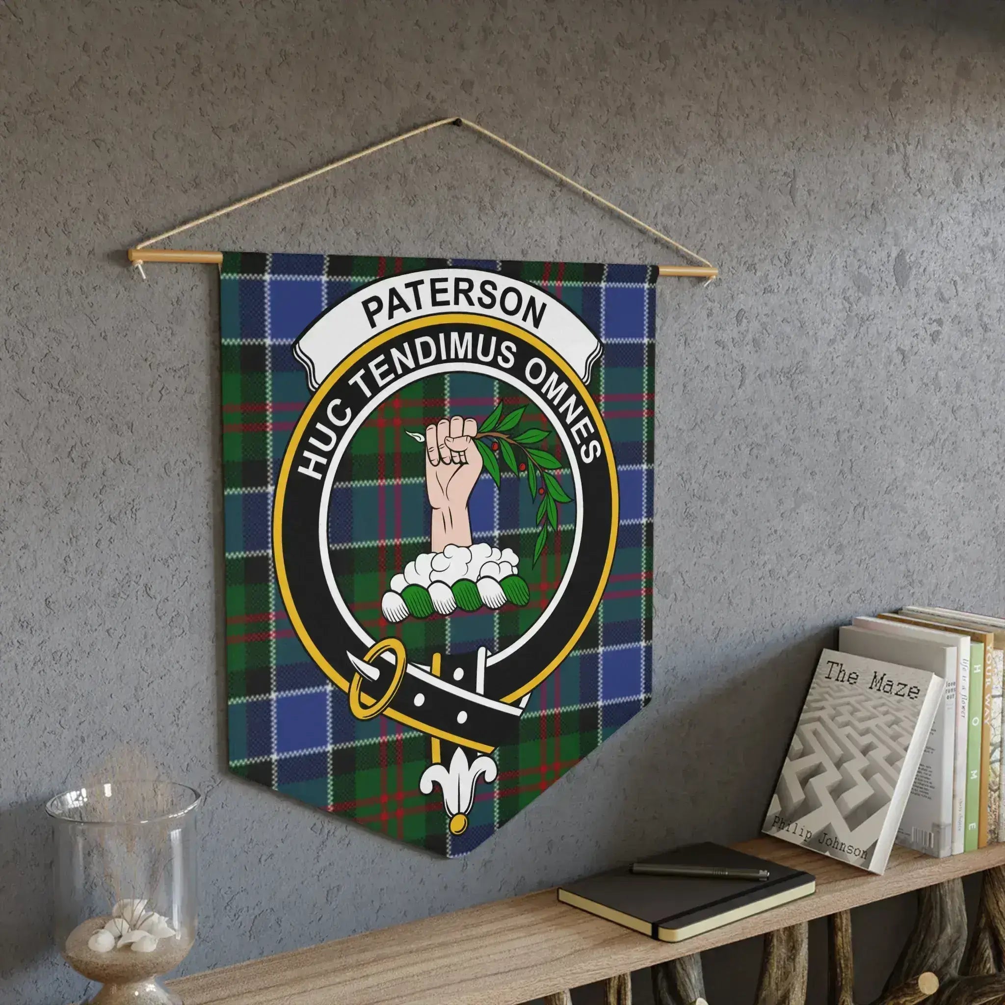 Paterson Huc Tendimus Omnes crest pennant on wall — laser-cut edges, bold tartan colours