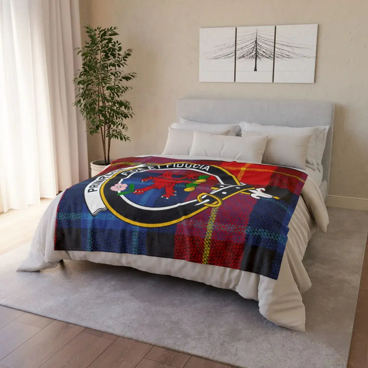 Clan Primrose throw blanket folded — showing red lion crest and tartan print