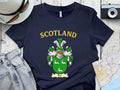 Rae Scottish clan crest t-shirt — front view of the printed crest on a tartan background