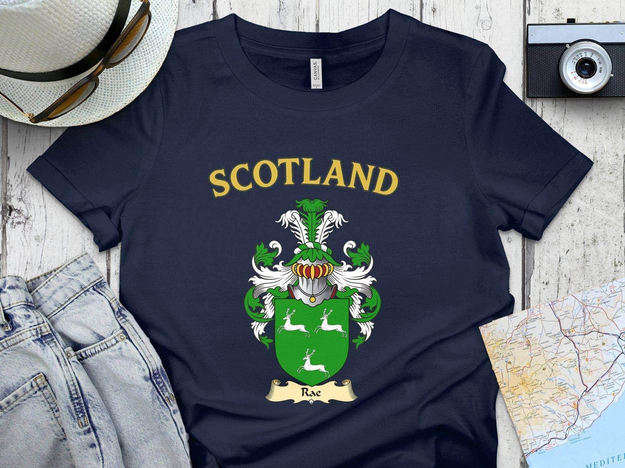 Rae Scottish clan crest t-shirt — front view of the printed crest on a tartan background
