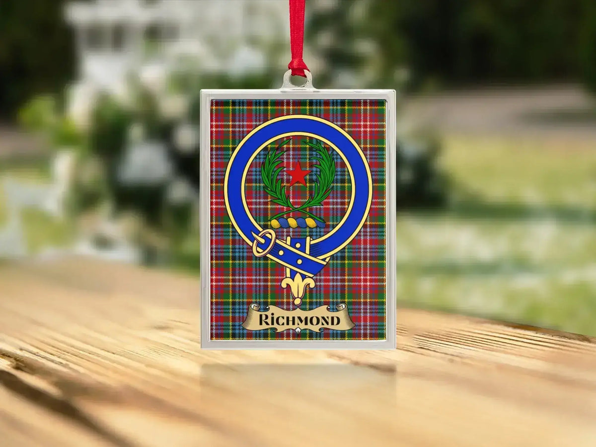 Close-up of the Richmond family crest on a polished silver-frame metal ornament