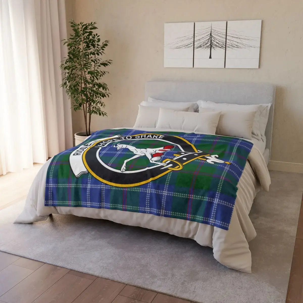 Riddell clan crest tartan throw draped on sofa — printed design, white reverse, hemmed edges