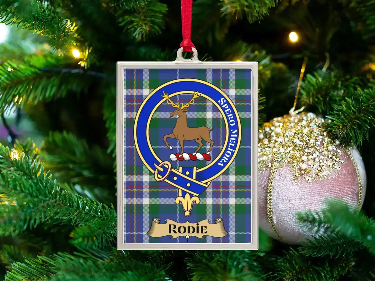 Rodie clan crest Christmas ornament in a silver frame on a tartan background