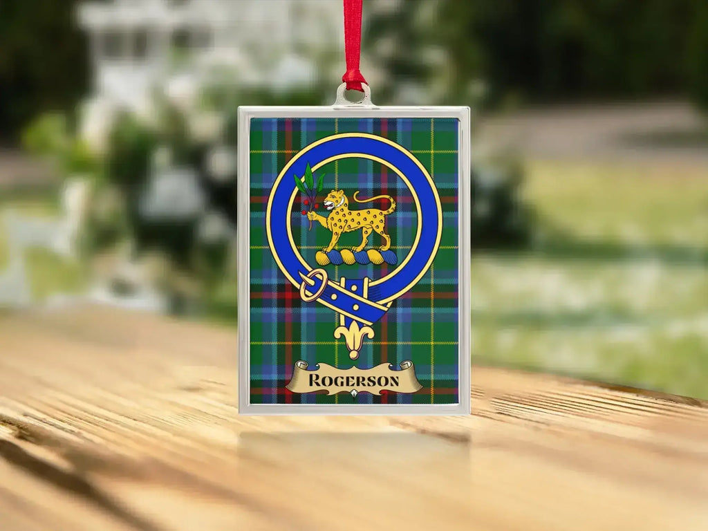 Close-up of the Rogerson family crest on a polished silver-frame metal ornament