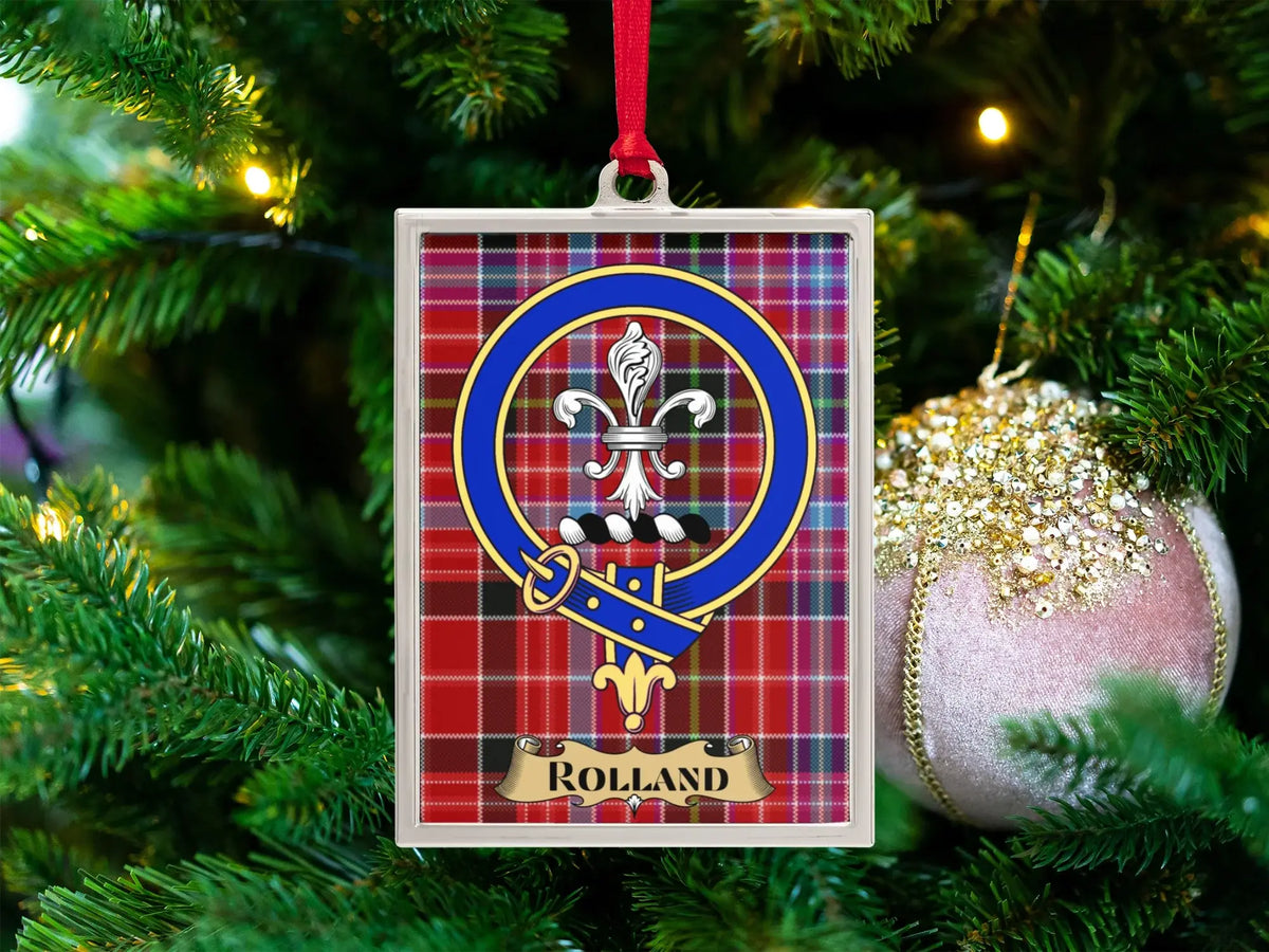 Rolland clan crest Christmas ornament in a silver frame on a tartan background