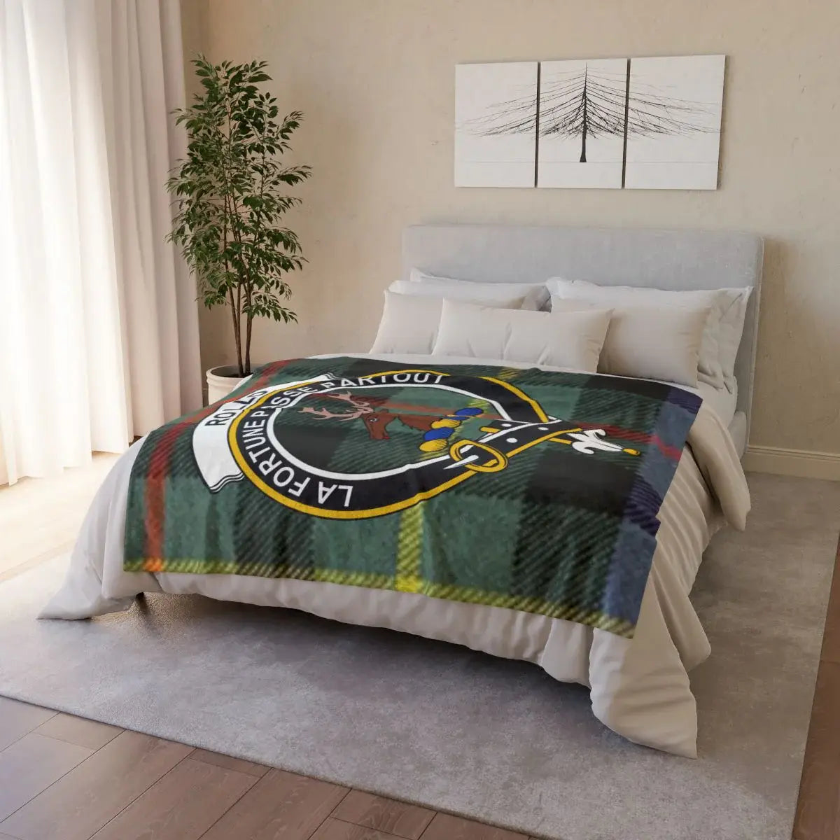 Rollo clan crest tartan throw draped on sofa — printed design, white reverse, hemmed edges