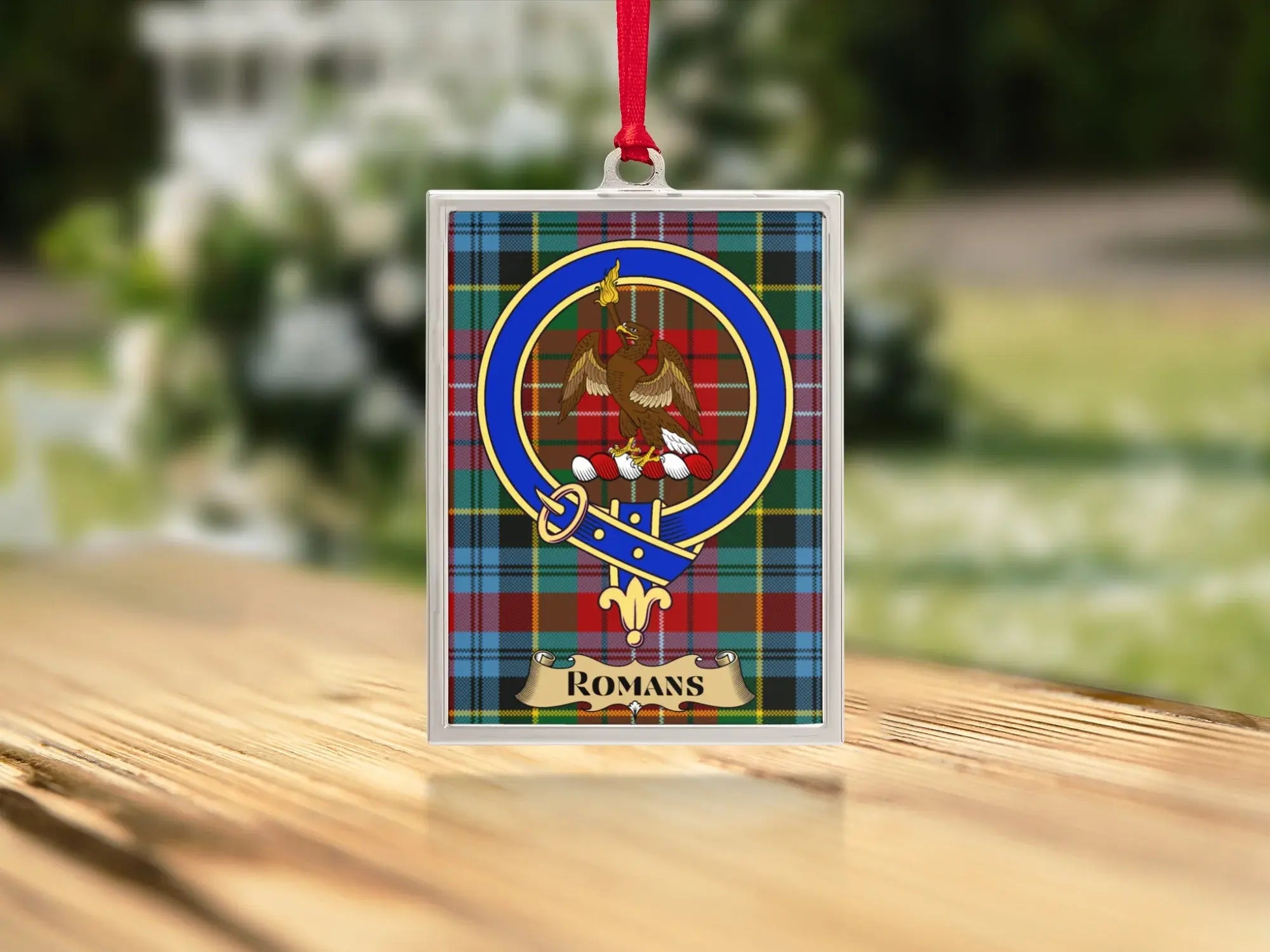 Close-up of the Romans family crest on a polished silver-frame metal ornament