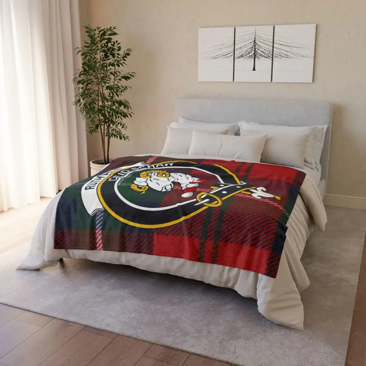 Clan Ruthven throw blanket folded — showing ram crest and tartan plaid print