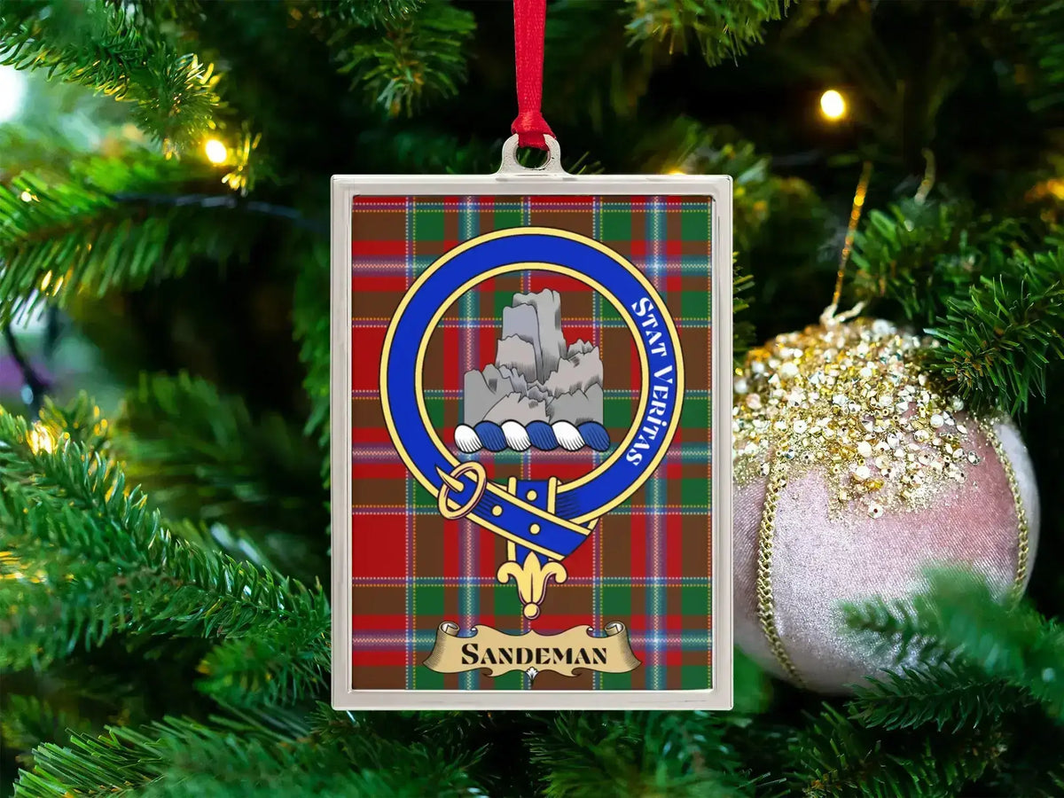 Sandeman clan crest Christmas ornament in a silver frame on a tartan background