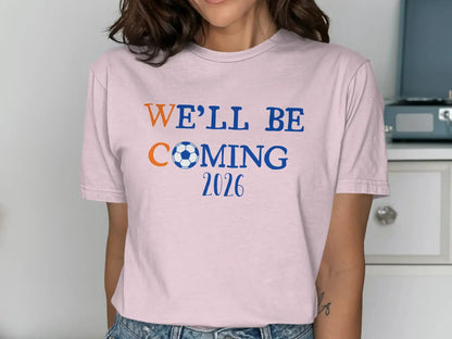 We'll Be Coming 2026 Soccer Fan Pink T-Shirt
