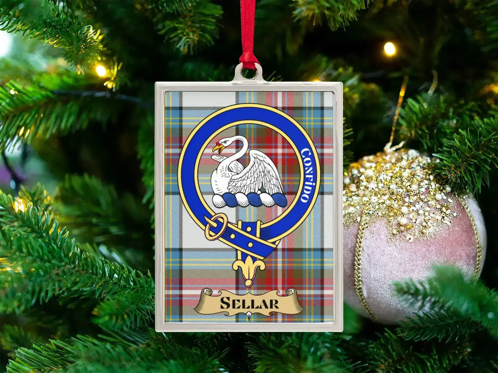 Sellar clan crest Christmas ornament in a silver frame on a tartan background