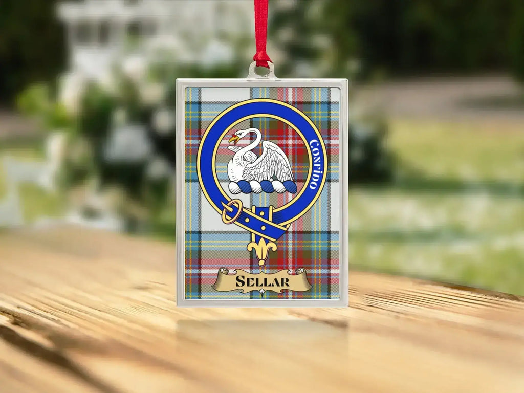 Close-up of the Sellar family crest on a polished silver-frame metal ornament