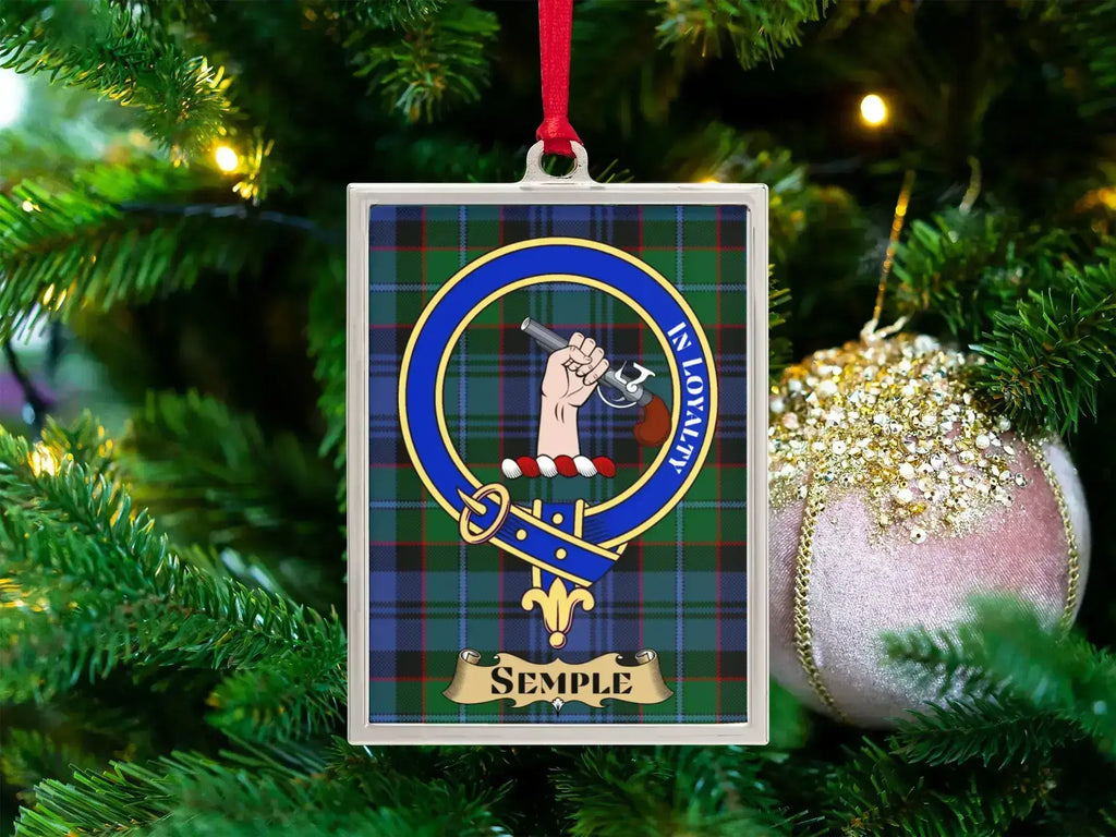 Semple clan crest Christmas ornament in a silver frame on a tartan background