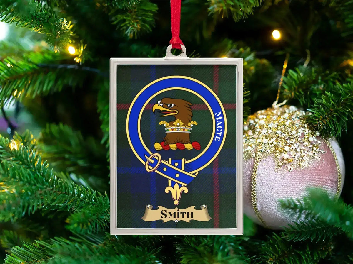 Smith clan crest Christmas ornament in a silver frame on a tartan background