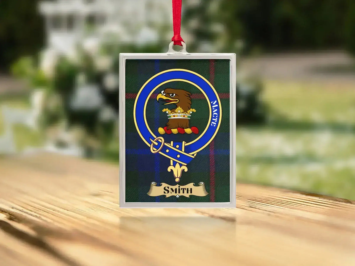 Close-up of the Smith family crest on a polished silver-frame metal ornament