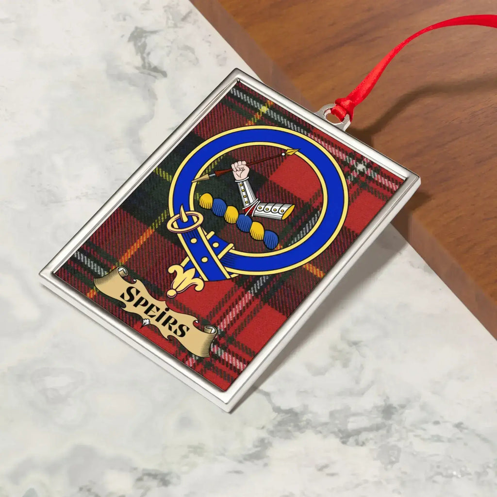 Speirs ornament hanging from a Christmas tree branch by its satin ribbon