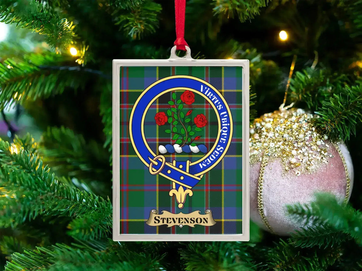 Stevenson clan crest Christmas ornament in a silver frame on a tartan background