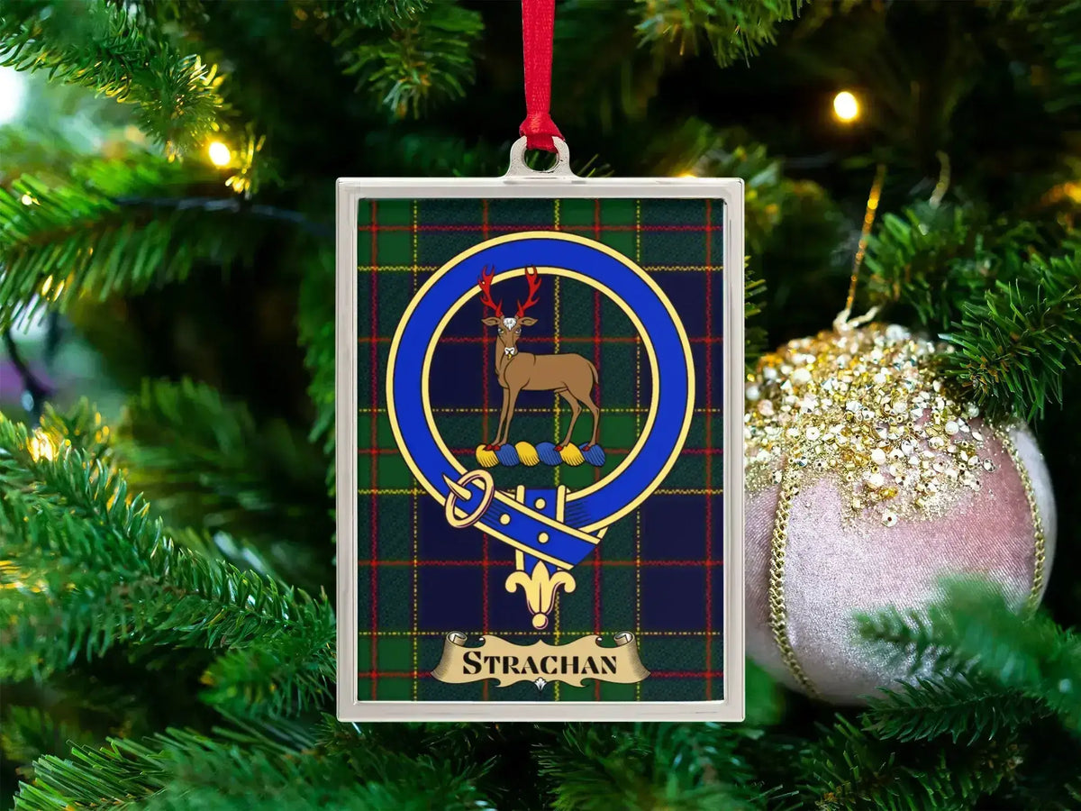 Strachan clan crest Christmas ornament in a silver frame on a tartan background