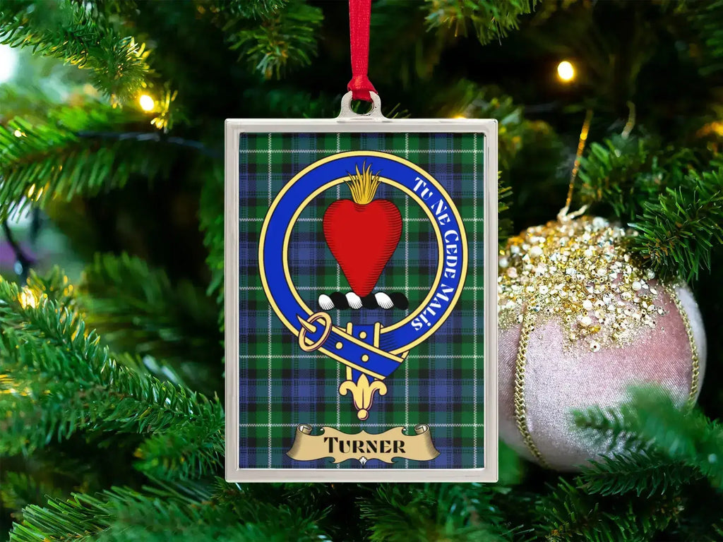 Turner clan crest Christmas ornament in a silver frame on a tartan background