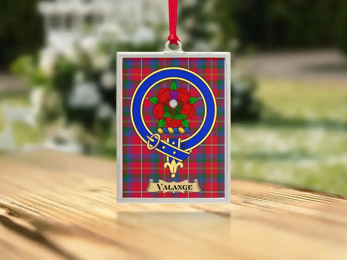 Close-up of the Valange family crest on a polished silver-frame metal ornament