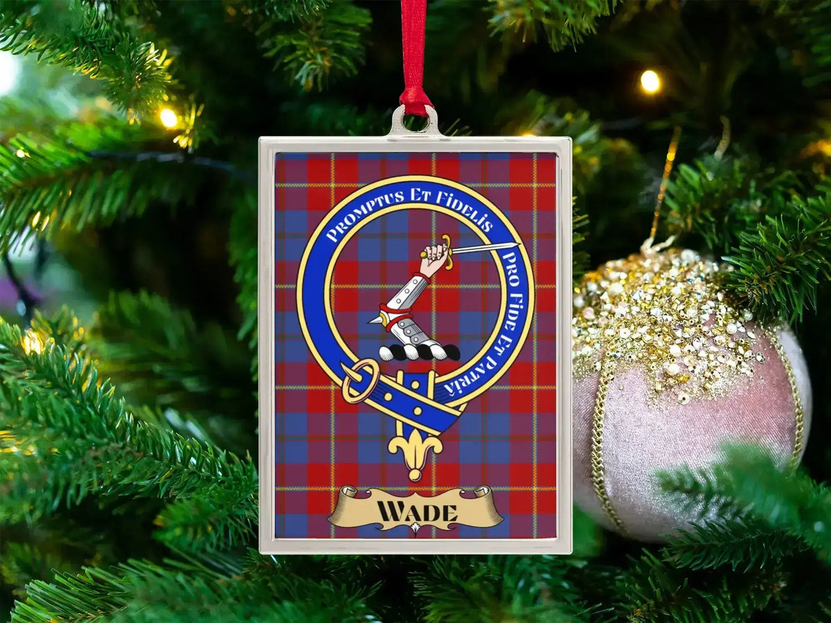 Wade clan crest Christmas ornament in a silver frame on a tartan background