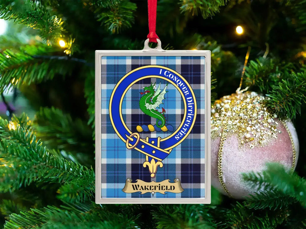 Wakefield clan crest Christmas ornament in a silver frame on a tartan background