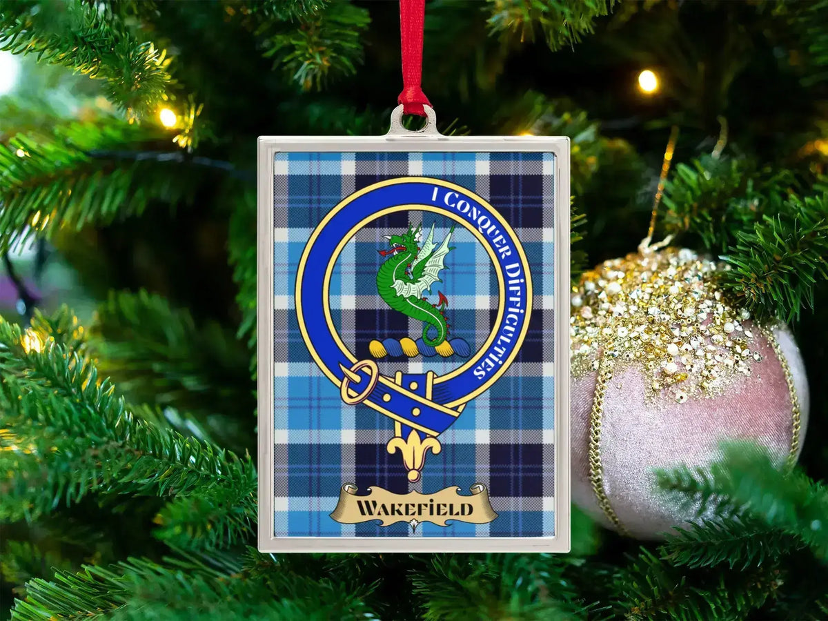 Wakefield clan crest Christmas ornament in a silver frame on a tartan background