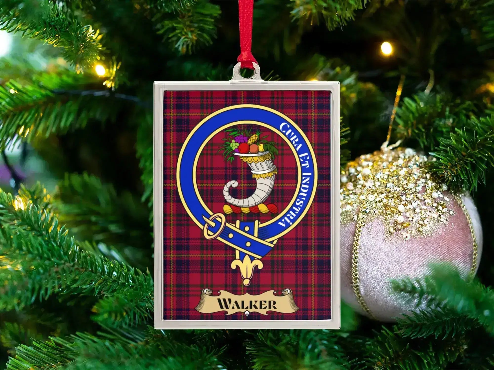 Walker clan crest Christmas ornament in a silver frame on a tartan background