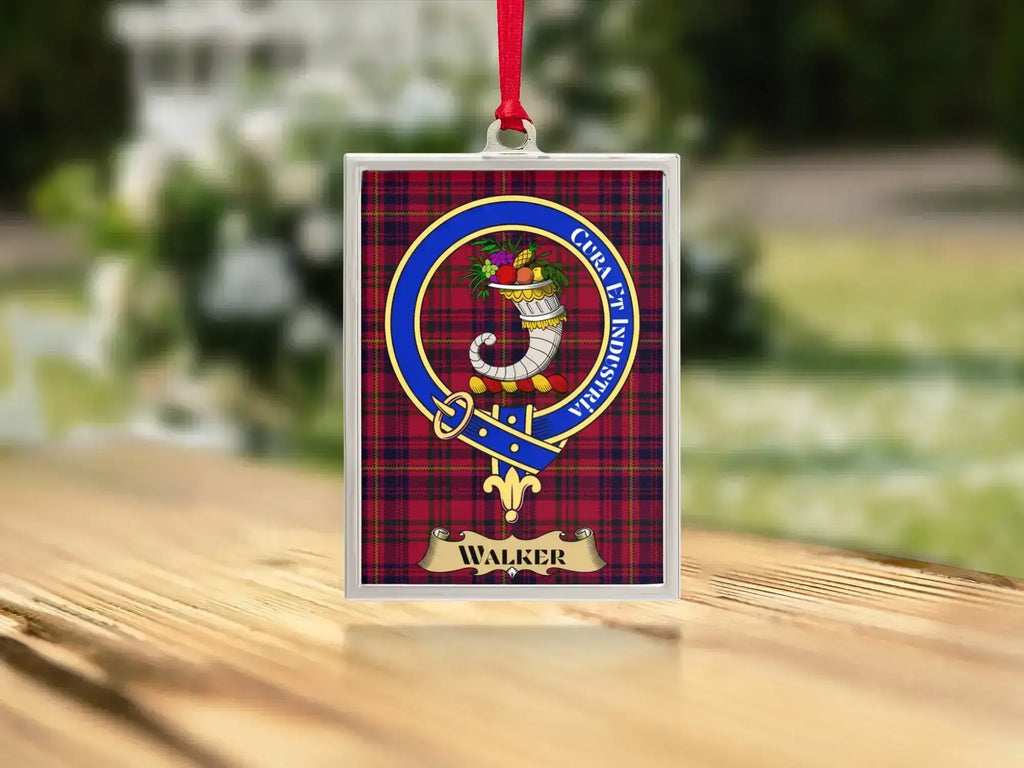 Close-up of the Walker family crest on a polished silver-frame metal ornament