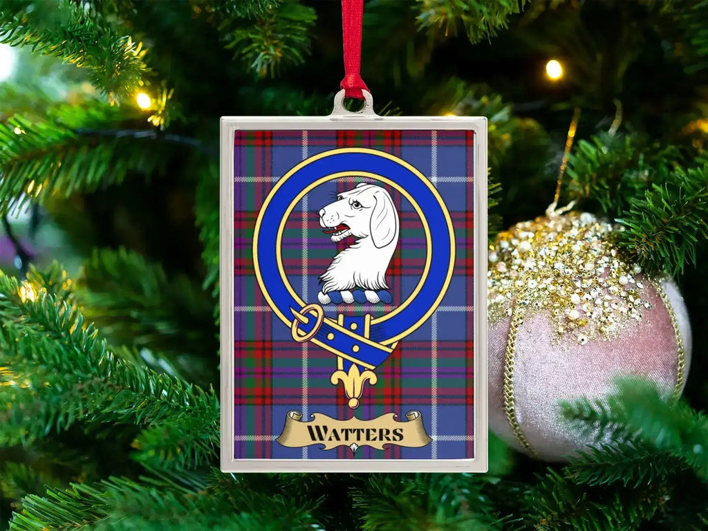 Watters clan crest Christmas ornament in a silver frame on a tartan background