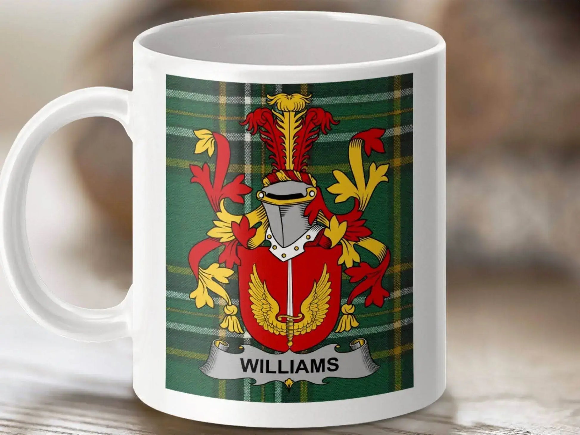 White mug featuring Williams family crest with red and gold design on green tartan background