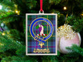 Winchester clan crest Christmas ornament in a silver frame on a tartan background