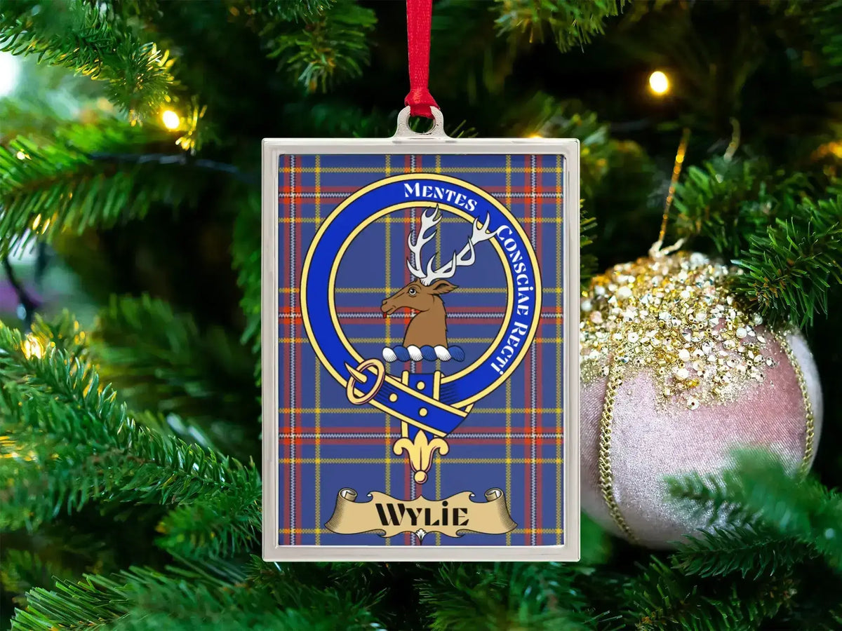 Wylie clan crest Christmas ornament in a silver frame on a tartan background