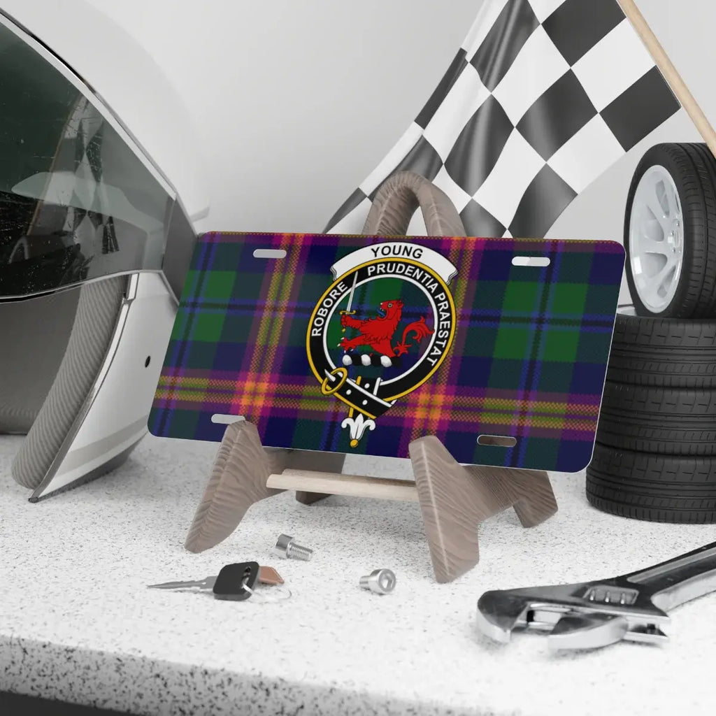 Young clan crest novelty license plate with motto on a tartan background, 12 x 6
