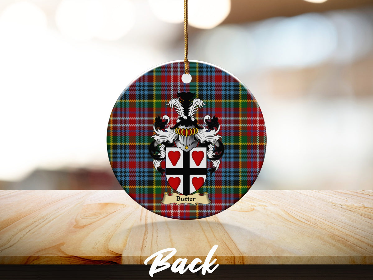 Round Butter Scottish clan ornament with family crest on a Caledonia tartan background