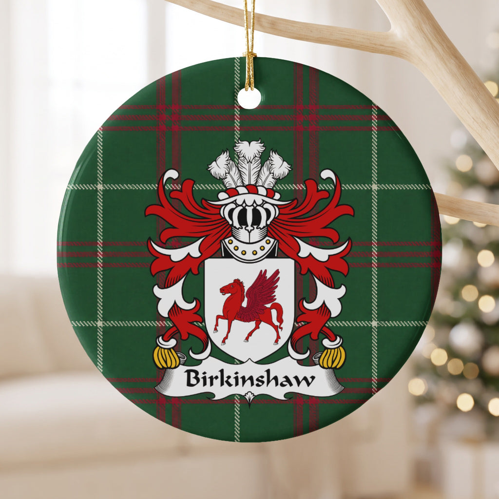 Birkinshaw ornament hanging from a pale wooden branch; a red winged horse on a white shield on Welsh national tartan.