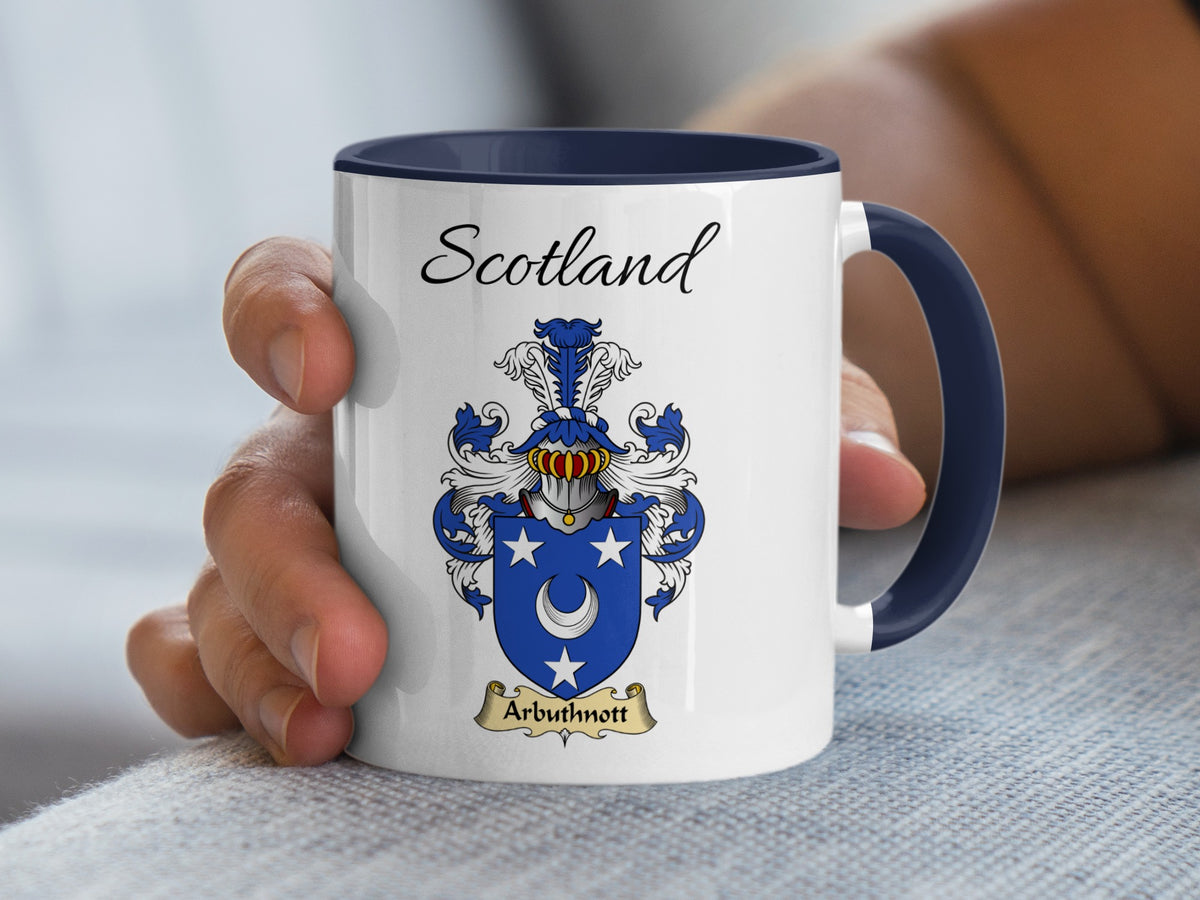 White Arbuthnott heritage mug with navy handle and interior, displaying “Scotland” and the colourful family emblem.