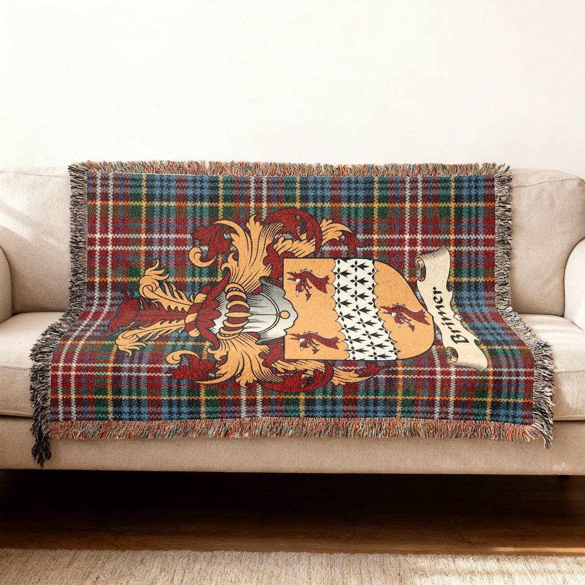 Brimer Scottish woven blanket with family shield and Caledonia tartan background