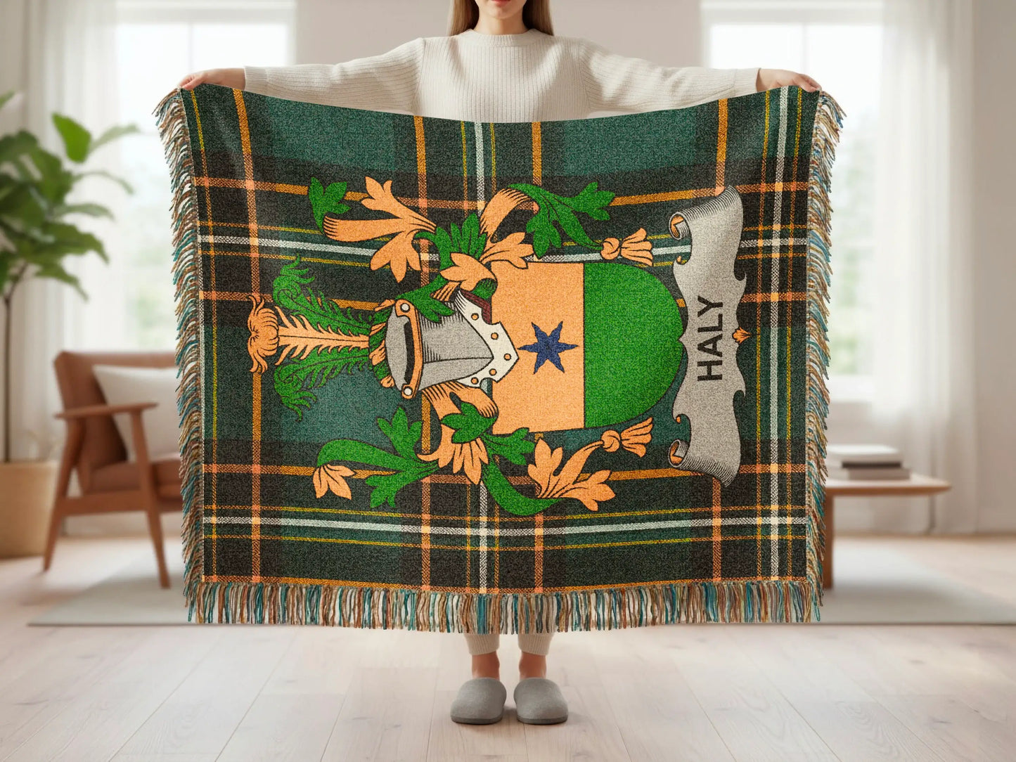Green and orange plaid blanket with Haly family crest displayed.