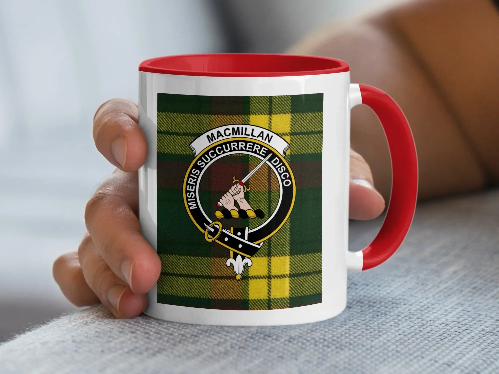 MacMillan tartan pattern shown across ceramic mug body — clan crest and motto detail